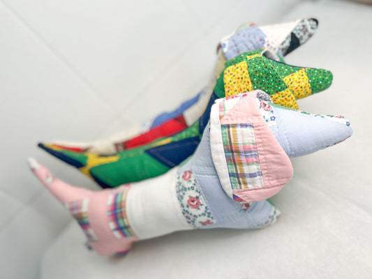 Colorful patchwork pillow with a multicolored pattern on a white background